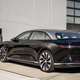 Lucid Air parks in front of a charger